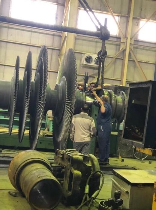Steam turbine rotor under overhaul in the workshop hall
