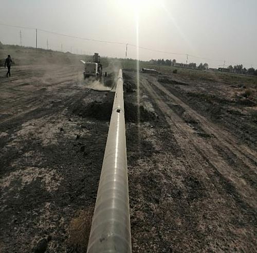 Pipeline section laid across open terrain during construction