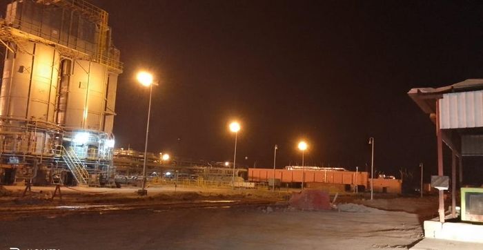 Power station lit at night during rehabilitation works
