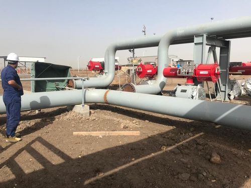 Above-ground gas manifold with actuated valves at an oilfield facility